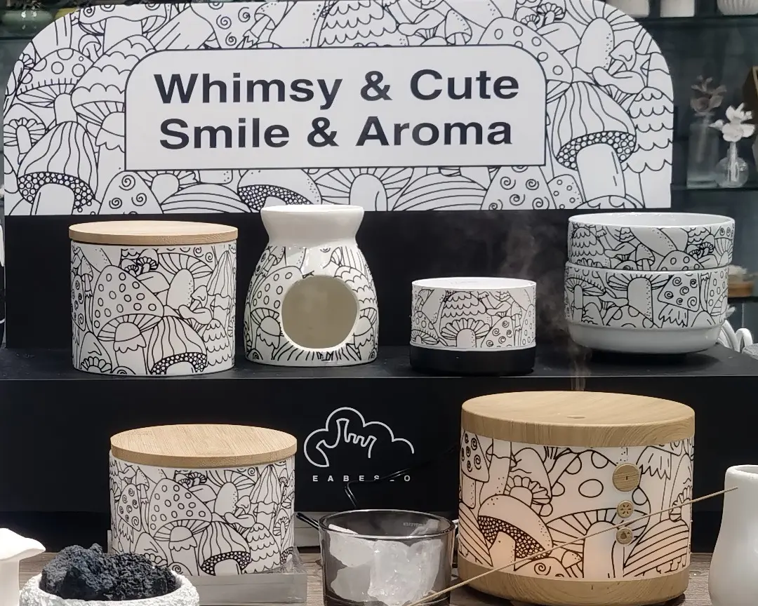 Green-Life aroma ware designs for home fragrance brands, featuring all-over black-and-white mushroom linework and natural wood-tone accents.